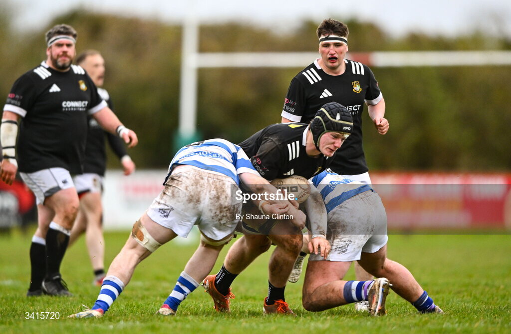 4 April 2026; Shane McGuigan of Longford RFC is tackled by John Sheedy of Athy RFC during the Bank of Ireland Provincial Towns Cup semi-final match between Athy RFC and Longford RFC at Cill Dara RFC in Silken Thomas Park in Kildare. Photo by Shauna Clinton/Sportsfile