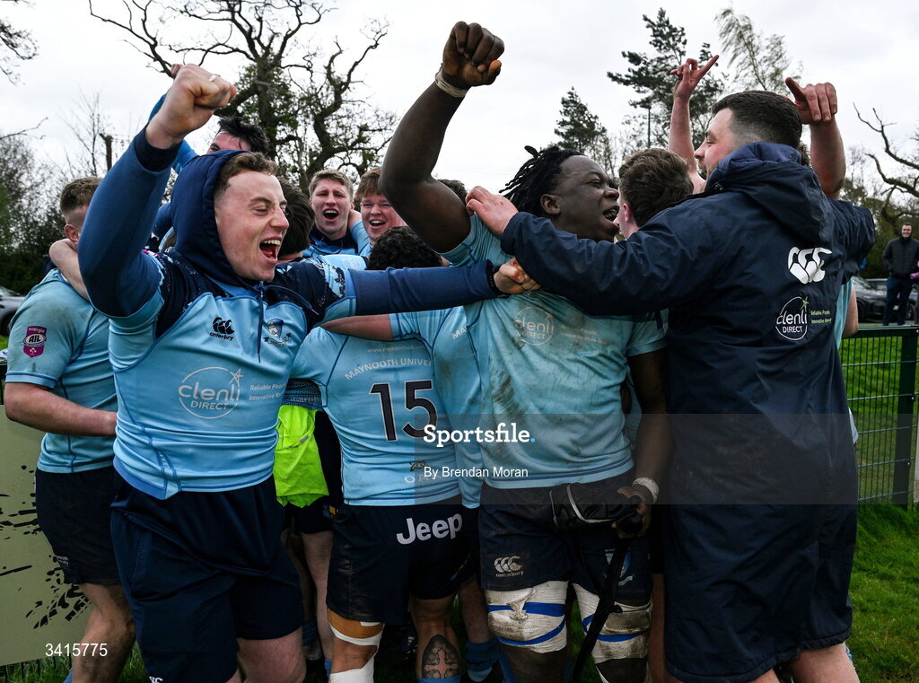 4 April 2026; Abdul Olaosebikan of MU Barnhall, centre, and teammates and supporters celebrate after the Energia Men's All-Ireland League Division match between MU Barnhall and Wanderers RFC at MU Barnhall RFC in Parsonstown, Kildare. Photo by Brendan Moran/Sportsfile