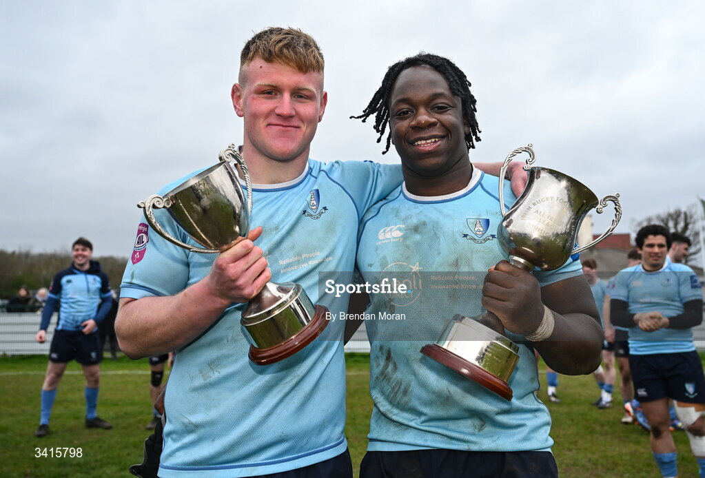 4 April 2026; MU Barnhall players Keith Farrell, left, and Abdul Olaosebikan celebrate with the Energia AIL Division 2 trophy after the Energia Men's All-Ireland League Division match between MU Barnhall and Wanderers RFC at MU Barnhall RFC in Parsonstown, Kildare. Photo by Brendan Moran/Sportsfile