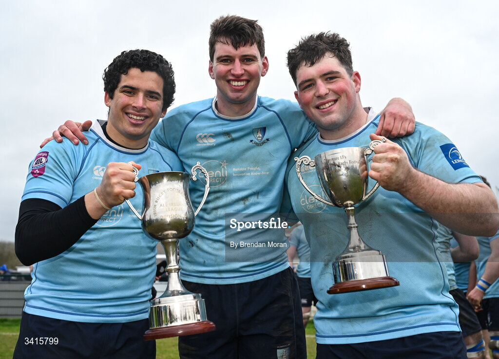 4 April 2026; MU Barnhall players, from left, Matias Giannetti, Jack Hannon and Jack Castles celebrate with the Energia AIL Division 2 trophy after the Energia Men's All-Ireland League Division match between MU Barnhall and Wanderers RFC at MU Barnhall RFC in Parsonstown, Kildare. Photo by Brendan Moran/Sportsfile