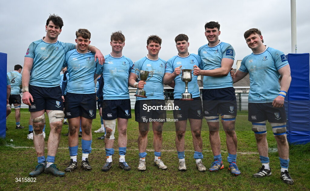 4 April 2026; MU Barnhall players, from left, Ciaran Enright, Oisin O'Neill, Adam Gray, Finn Brien, Neil Byrne, Sean Walsh and Eoin Kelly celebrate with the Energia AIL Division 2 trophy after the Energia Men's All-Ireland League Division match between MU Barnhall and Wanderers RFC at MU Barnhall RFC in Parsonstown, Kildare. Photo by Brendan Moran/Sportsfile