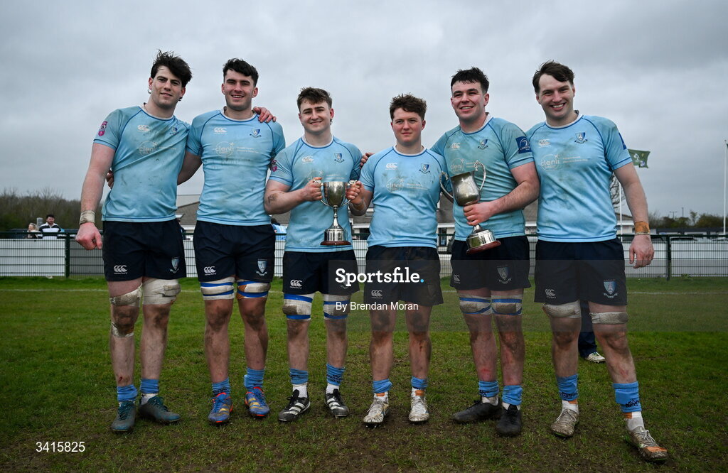 4 April 2026; MU Barnhall players, from left, Ciaran Enright Sean Walsh, Eoin Kelly, Finn Brien, Dan Murphy and Stephen Callinan celebrate with the Energia AIL Division 2 trophy after the Energia Men's All-Ireland League Division match between MU Barnhall and Wanderers RFC at MU Barnhall RFC in Parsonstown, Kildare. Photo by Brendan Moran/Sportsfile