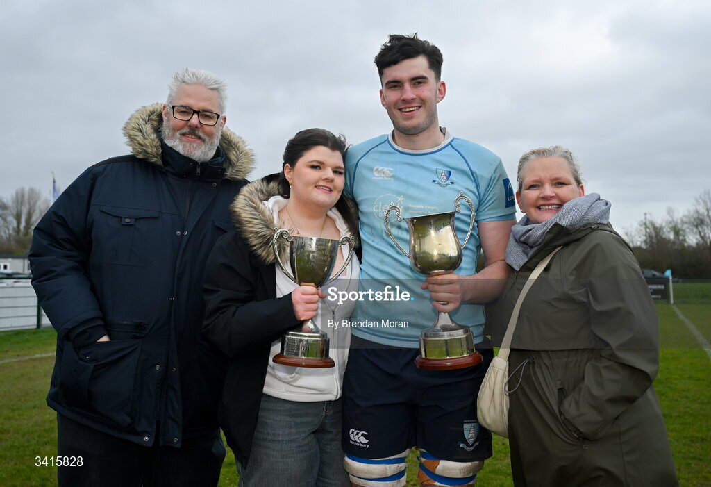 4 April 2026; Sean Walsh of MU Barnhall celebrates with his family Roy, Isobel and Katie and the Energia AIL Division 2 trophy after the Energia Men's All-Ireland League Division match between MU Barnhall and Wanderers RFC at MU Barnhall RFC in Parsonstown, Kildare. Photo by Brendan Moran/Sportsfile