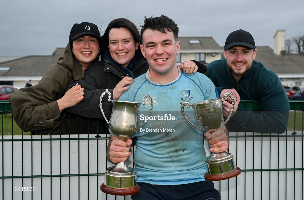 4 April 2026; Dan Murphy of MU Barnhall celebrates with Ellen Murphy, Orla Murray and Andrew Irwin and the Energia AIL Division 2 trophy after the Energia Men's All-Ireland League Division match between MU Barnhall and Wanderers RFC at MU Barnhall RFC in Parsonstown, Kildare. Photo by Brendan Moran/Sportsfile