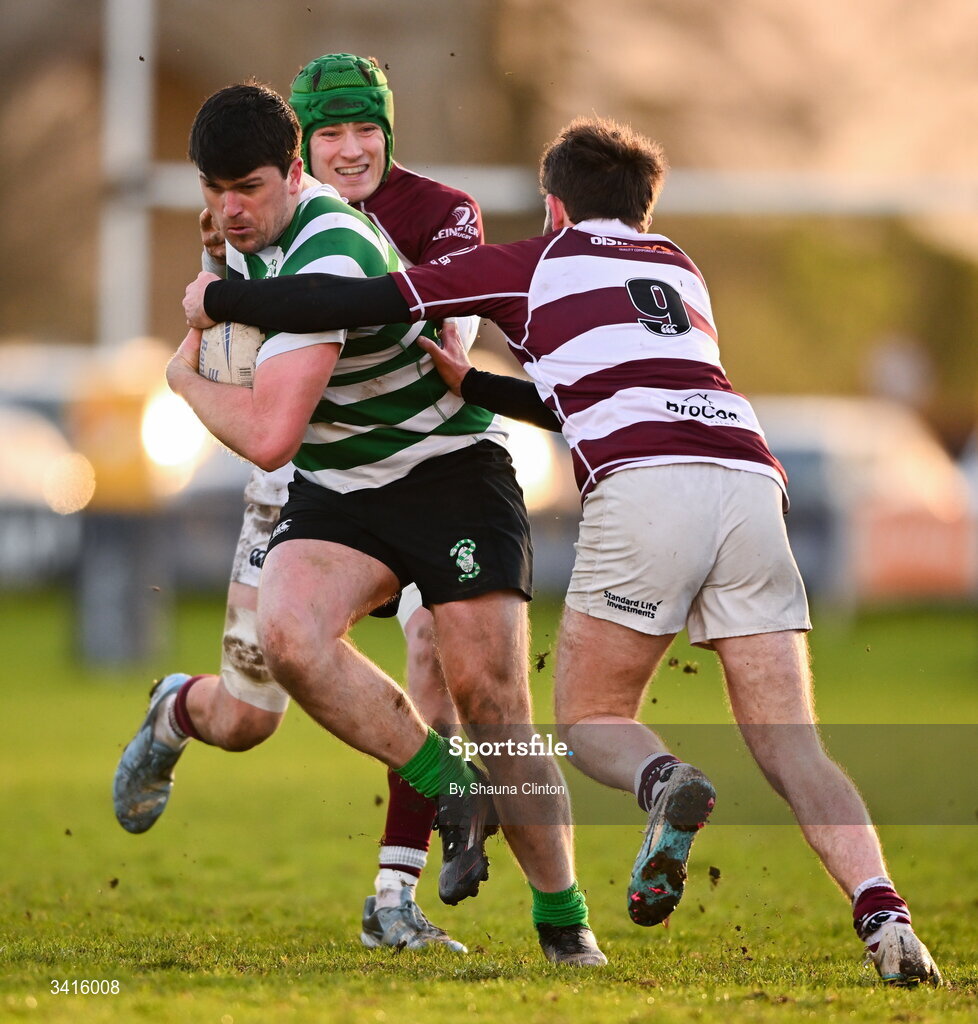 4 April 2026; David Butler of Naas RFC is tackled by Tullow RFC players Tom Hughes, left, and Cian Leonard during the Bank of Ireland Provincial Towns Cup semi-final match between Naas RFC and Tullow RFC at County Carlow RFC in Oakpark, Carlow. Photo by Shauna Clinton/Sportsfile