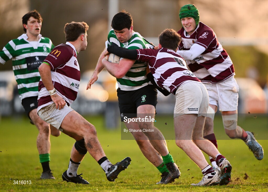 4 April 2026; David Butler of Naas RFC is tackled by Tullow RFC players Tom Hughes, left, and Cian Leonard during the Bank of Ireland Provincial Towns Cup semi-final match between Naas RFC and Tullow RFC at County Carlow RFC in Oakpark, Carlow. Photo by Shauna Clinton/Sportsfile
