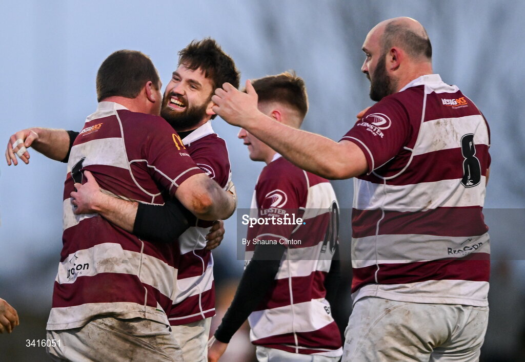 4 April 2026; Scott Caldbeck of Tullow RFC, centre, is congratulated by team-mates after scoring his side's second try during the Bank of Ireland Provincial Towns Cup semi-final match between Naas RFC and Tullow RFC at County Carlow RFC in Oakpark, Carlow. Photo by Shauna Clinton/Sportsfile
