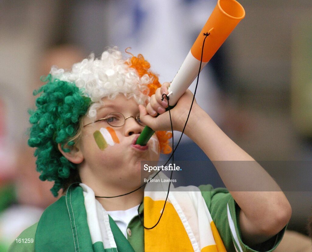 17 October 2004; Young Irish fan Muiris Bartley cheers on his side during the game. Coca Cola International Rules Series 2004, First Test, Ireland v Australia, Croke Park, Dublin. Picture credit; Brian Lawless / SPORTSFILE *** Local Caption *** Any photograph taken by SPORTSFILE during, or in connection with, the 2004 Coca Cola International Rules Series which displays GAA logos or contains an image or part of an image of any GAA intellectual property, or, which contains images of a GAA player/players in their playing uniforms, may only be used for editorial and non-advertising purposes.  Use of photographs for advertising, as posters or for purchase separately is strictly prohibited unless prior written approval has been obtained from the Gaelic Athletic Association.