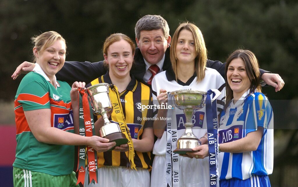 23 November 2004; Opposing captains in the AIB All-Ireland Ladies Club Senior Football Final, Karen Hopkins, right, of Ballyboden St Endas, and Juliet Murphy, 2nd from right, Donaghmore, Cork, with Junior Finalists, Voureen Quigley, left, of Iniskeen, Monaghan and Noreen Fealy, 2nd from left, of Abbeydorney, Kerry, with Billy Finn, AIB, at a photocall ahead of the AIB Ladies Football All-Ireland Club Finals with the Senior and Junior Finals on Sunday next, 28th November, and the Intermediate Final on Sunday 5th December. AIB Bankcentre, Ballsbridge, Dublin. Picture credit; Brendan Moran / SPORTSFILE