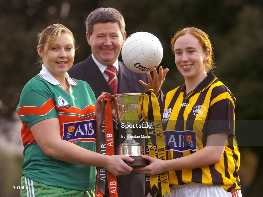 23 November 2004; Opposing players in the AIB All-Ireland Ladies Club Junior Football Final, Voureen Quigley, left, of Inniskeen, Monaghan, and Noreen Fealy of Abbeydorney, Kerry, with Billy Finn, AIB, at a photocall ahead of the AIB Ladies Football All-Ireland Club Finals with the Senior and Junior Finals on Sunday next, 28th November, and the Intermediate Final on Sunday 5th December. AIB Bankcentre, Ballsbridge, Dublin. Picture credit; Brendan Moran / SPORTSFILE
