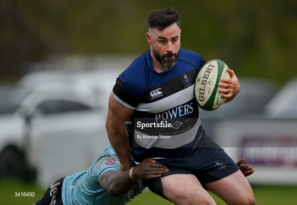 4 April 2026; Mick McGrath of Wanderers is tackled by Abdul Olaosebikan of MU Barnhall during the Energia Men's All-Ireland League Division match between MU Barnhall and Wanderers RFC at MU Barnhall RFC in Parsonstown, Kildare. Photo by Brendan Moran/Sportsfile