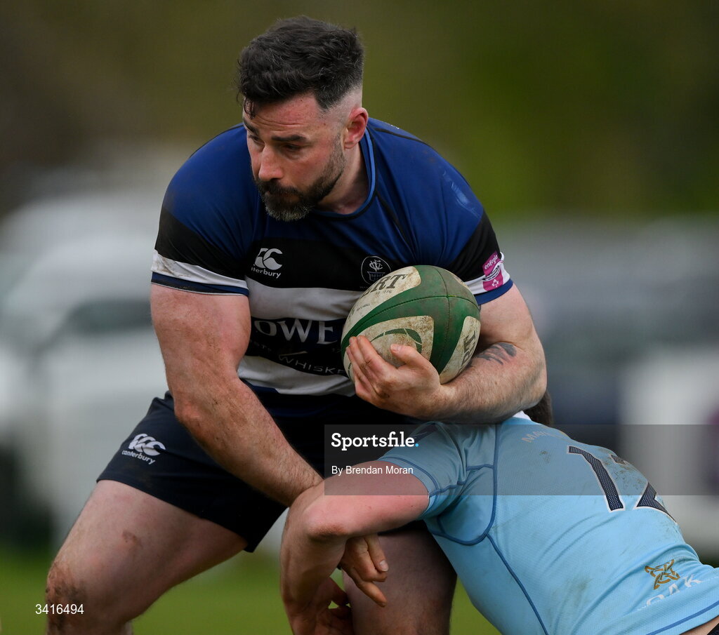 4 April 2026; Mick McGrath of Wanderers is tackled by Jack Hannon of MU Barnhall during the Energia Men's All-Ireland League Division match between MU Barnhall and Wanderers RFC at MU Barnhall RFC in Parsonstown, Kildare. Photo by Brendan Moran/Sportsfile