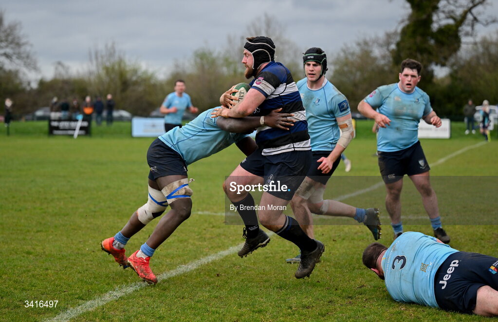 4 April 2026; JJ McIraith of Wanderers is tackled by Abdul Olaosebikan of MU Barnhall during the Energia Men's All-Ireland League Division match between MU Barnhall and Wanderers RFC at MU Barnhall RFC in Parsonstown, Kildare. Photo by Brendan Moran/Sportsfile
