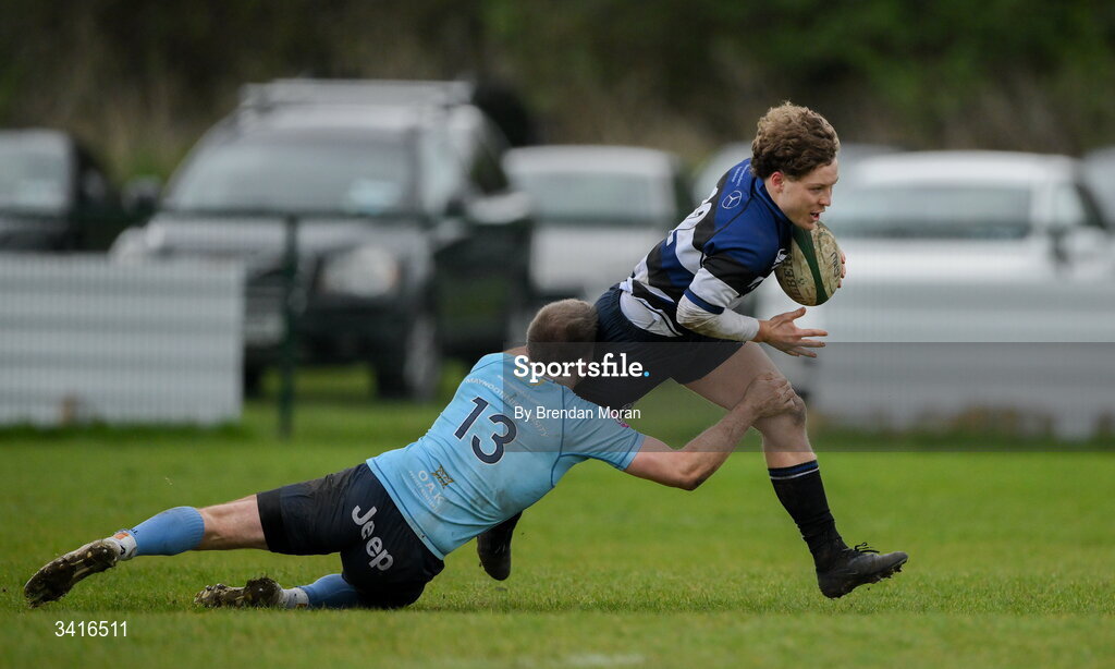 4 April 2026; Louis McDonagh of Wanderers is tackled by Shane Mallon of MU Barnhall during the Energia Men's All-Ireland League Division match between MU Barnhall and Wanderers RFC at MU Barnhall RFC in Parsonstown, Kildare. Photo by Brendan Moran/Sportsfile