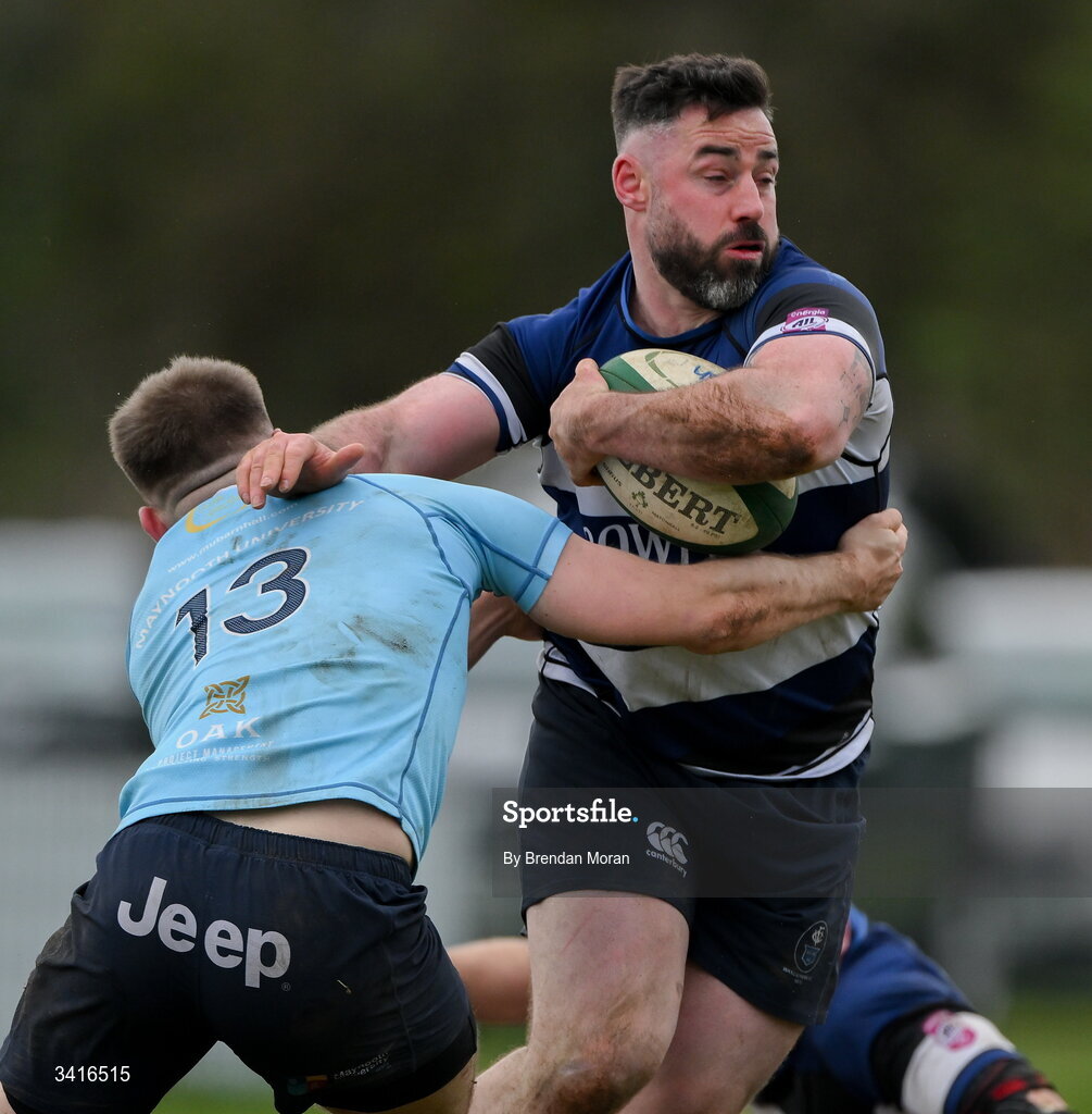 4 April 2026; Mick McGrath of Wanderers is tackled by Shane Mallon of MU Barnhall during the Energia Men's All-Ireland League Division match between MU Barnhall and Wanderers RFC at MU Barnhall RFC in Parsonstown, Kildare. Photo by Brendan Moran/Sportsfile