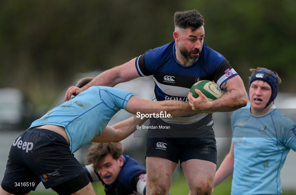 4 April 2026; Mick McGrath of Wanderers is tackled by Shane Mallon of MU Barnhall during the Energia Men's All-Ireland League Division match between MU Barnhall and Wanderers RFC at MU Barnhall RFC in Parsonstown, Kildare. Photo by Brendan Moran/Sportsfile