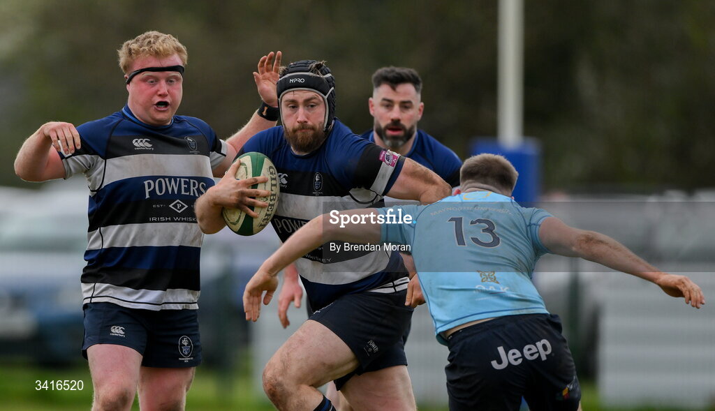 4 April 2026; JJ McIraith of Wanderers is tackled by Shane Mallon of MU Barnhall during the Energia Men's All-Ireland League Division match between MU Barnhall and Wanderers RFC at MU Barnhall RFC in Parsonstown, Kildare. Photo by Brendan Moran/Sportsfile