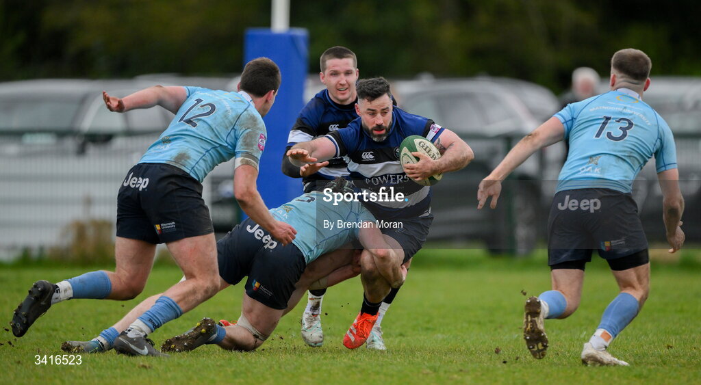 4 April 2026; Mick McGrath of Wanderers is tackled by Ciaran Enright of MU Barnhall during the Energia Men's All-Ireland League Division match between MU Barnhall and Wanderers RFC at MU Barnhall RFC in Parsonstown, Kildare. Photo by Brendan Moran/Sportsfile