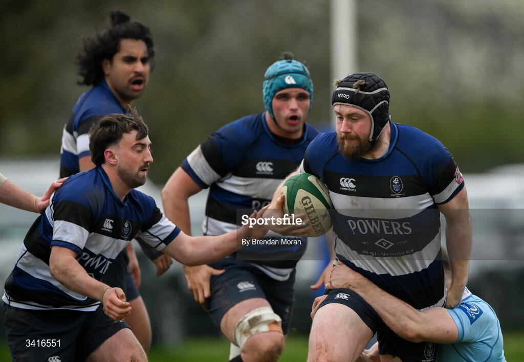 4 April 2026; JJ McIraith of Wanderers is tackled by Shane Mallon of MU Barnhall during the Energia Men's All-Ireland League Division match between MU Barnhall and Wanderers RFC at MU Barnhall RFC in Parsonstown, Kildare. Photo by Brendan Moran/Sportsfile