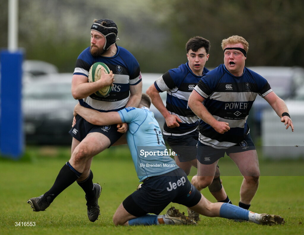 4 April 2026; JJ McIraith of Wanderers is tackled by Shane Mallon of MU Barnhall during the Energia Men's All-Ireland League Division match between MU Barnhall and Wanderers RFC at MU Barnhall RFC in Parsonstown, Kildare. Photo by Brendan Moran/Sportsfile