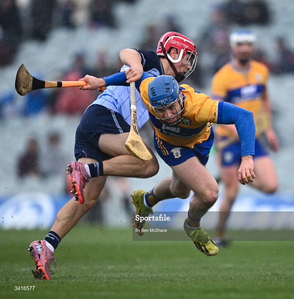 5 April 2026; Shane O'Donnell of Clare is tackled by Conor Groarke of Dublin during the Allianz Hurling League Division 1B final match between Clare and Dublin at TUS Gaelic Grounds in Limerick. Photo by Ben McShane/Sportsfile