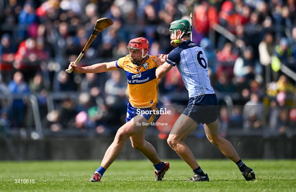 5 April 2026; Peter Duggan of Clare is tackled by Chris Crummey of Dublin during the Allianz Hurling League Division 1B final match between Clare and Dublin at TUS Gaelic Grounds in Limerick. Photo by Ben McShane/Sportsfile