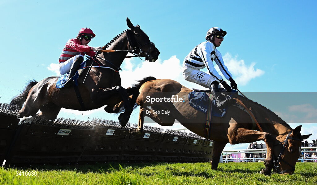 5 April 2026; Royal Soldier and jockey Donagh Meyler, right, fall at the last, as eventual winner Katie Daniels, left, with Ben Harvey up, clear the last on their way to winning the Cawley Furniture Novice Handicap Hurdle during day two of the Fairyhouse Easter Festival at Fairyhouse Racecourse in Ratoath, Meath. Photo by Seb Daly/Sportsfile