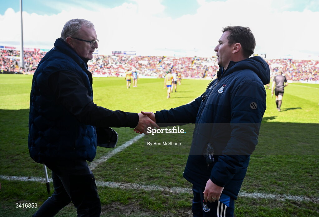 5 April 2026; Dublin manager Niall Ó Ceallacháin, right, and Clare manager Brian Lohan shake hands after the Allianz Hurling League Division 1B final match between Clare and Dublin at TUS Gaelic Grounds in Limerick. Photo by Ben McShane/Sportsfile