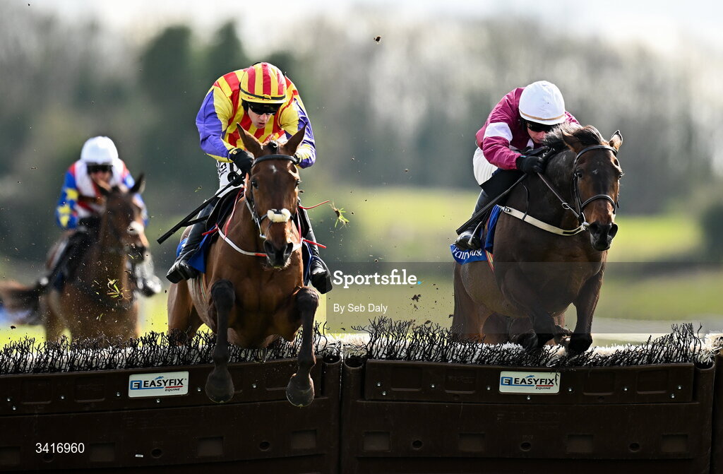 5 April 2026; Zanoosh, left, with Brian Hayes up, jumps the last on their way to winning the Irish Stallion Farms EBF Honeysuckle Mares Novice Hurdle, from second place Place De La Nation, right, with Danny Gilligan up, during day two of the Fairyhouse Easter Festival at Fairyhouse Racecourse in Ratoath, Meath. Photo by Seb Daly/Sportsfile