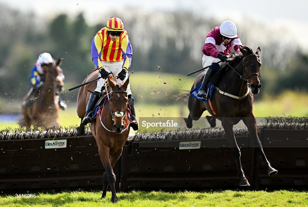 5 April 2026; Zanoosh, left, with Brian Hayes up, jumps the last on their way to winning the Irish Stallion Farms EBF Honeysuckle Mares Novice Hurdle, from second place Place De La Nation, right, with Danny Gilligan up, during day two of the Fairyhouse Easter Festival at Fairyhouse Racecourse in Ratoath, Meath. Photo by Seb Daly/Sportsfile