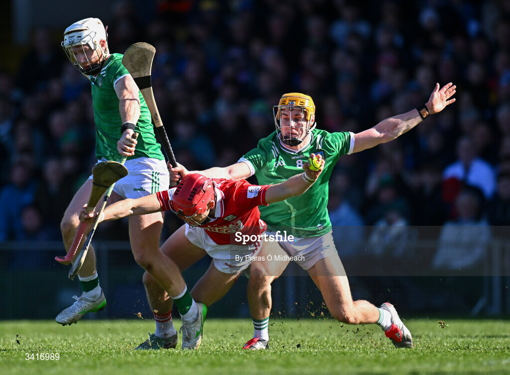5 April 2026; Alan Connolly of Cork in action against Kyle Hayes, left, and Adam English of Limerick during the Allianz Hurling League Division 1A final match between Limerick and Cork at TUS Gaelic Grounds in Limerick. Photo by Piaras Ó Mídheach/Sportsfile