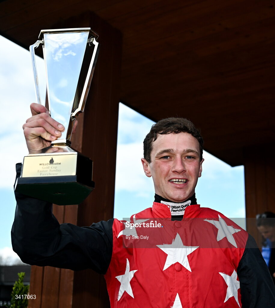 5 April 2026; Jockey Cian Quirke celebrates with the trophy after winning the WillowWarm Gold Cup on Fleur In The Park during day two of the Fairyhouse Easter Festival at Fairyhouse Racecourse in Ratoath, Meath. Photo by Seb Daly/Sportsfile