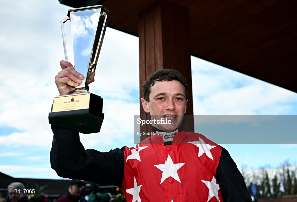 5 April 2026; Jockey Cian Quirke celebrates with the trophy after winning the WillowWarm Gold Cup on Fleur In The Park during day two of the Fairyhouse Easter Festival at Fairyhouse Racecourse in Ratoath, Meath. Photo by Seb Daly/Sportsfile