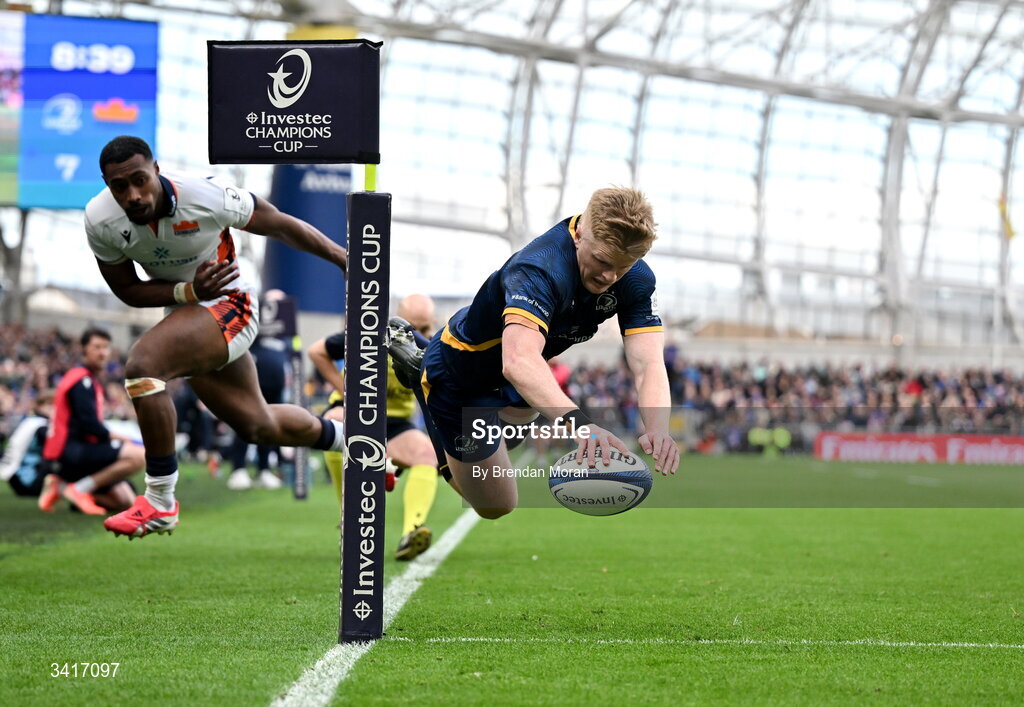 5 April 2026; Tommy O'Brien of Leinster scores his and his side's second try despite the attempted tackle of Malelili Satala during the Investec Champions Cup match between Leinster and Edinburgh at the Aviva Stadium in Dublin. Photo by Brendan Moran/Sportsfile