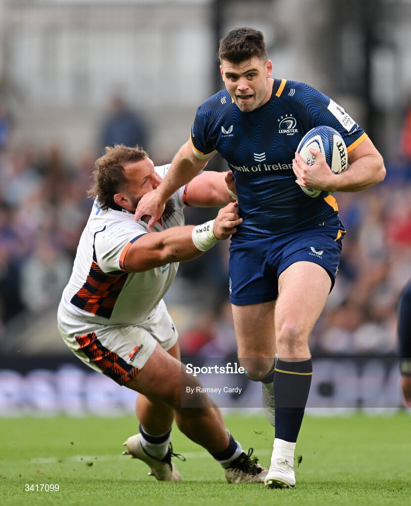 5 April 2026; Harry Byrne of Leinster is tackled by Pierre Schoeman of Edinburgh during the Investec Champions Cup match between Leinster and Edinburgh at the Aviva Stadium in Dublin. Photo by Ramsey Cardy/Sportsfile
