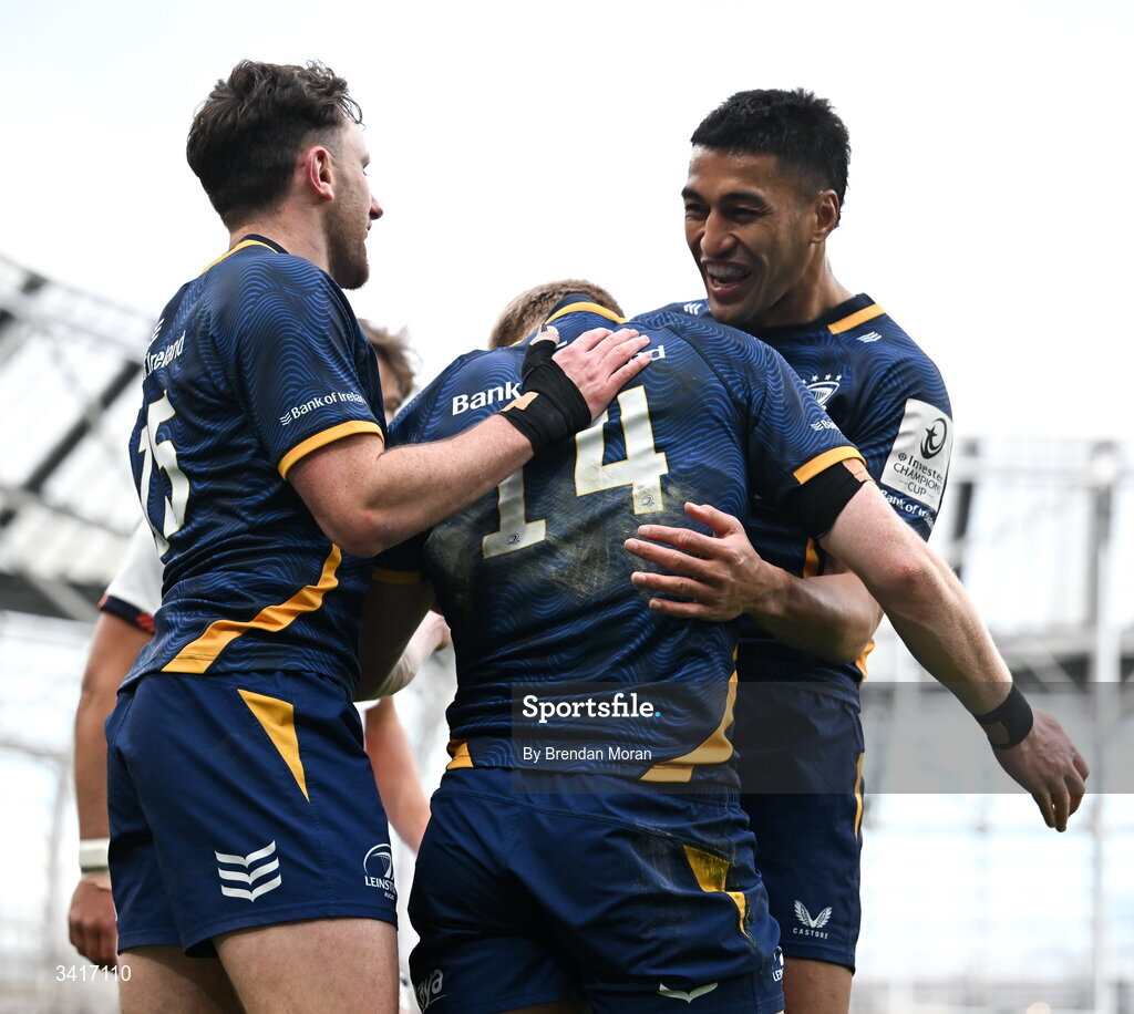 5 April 2026; Tommy O'Brien of Leinster celebrates with teamates Hugo Keenan and Rieko Ioane after scoring his side's second try during the Investec Champions Cup match between Leinster and Edinburgh at the Aviva Stadium in Dublin. Photo by Brendan Moran/Sportsfile