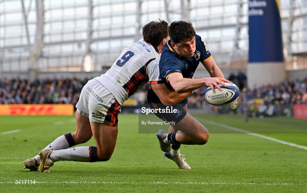 5 April 2026; Jimmy O'Brien of Leinster dives over to score his side's third try despite the attention of Charlie Shiel of Edinburgh during the Investec Champions Cup match between Leinster and Edinburgh at the Aviva Stadium in Dublin. Photo by Ramsey Cardy/Sportsfile