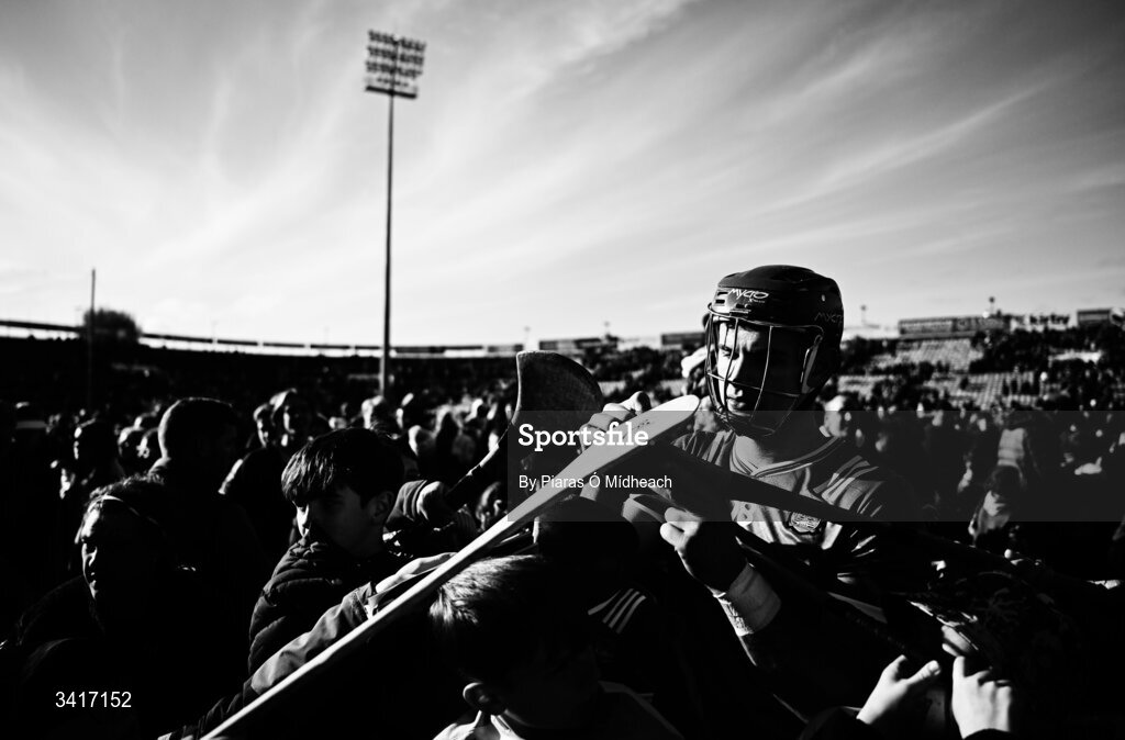 5 April 2026; EDITORS NOTE: Image has been shot in black and white. Colour version not available.) Colin Coughlan of Limerick signs autographs after his side's victory in the Allianz Hurling League Division 1A final match between Limerick and Cork at TUS Gaelic Grounds in Limerick. Photo by Piaras Ó Mídheach/Sportsfile