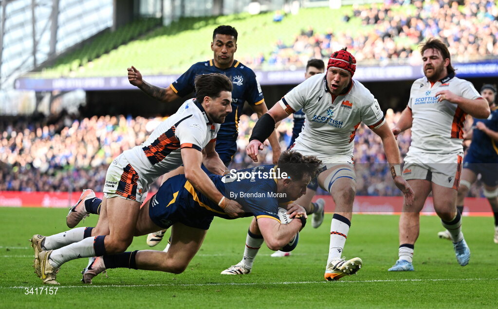 5 April 2026; Hugo Keenan of Leinster scores his side's fourth try despite the tackle of Charlie Shiel of Edinburgh during the Investec Champions Cup match between Leinster and Edinburgh at the Aviva Stadium in Dublin. Photo by Brendan Moran/Sportsfile