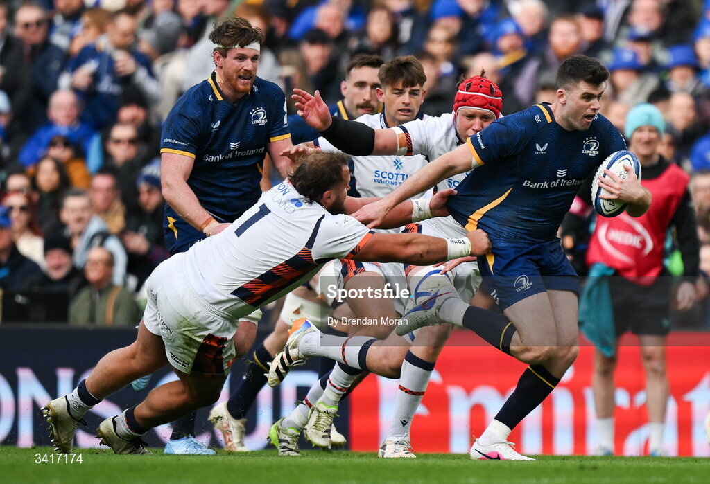 5 April 2026; Harry Byrne of Leinster beats the tackle of Pierre Schoeman of Edinburgh during the Investec Champions Cup match between Leinster and Edinburgh at the Aviva Stadium in Dublin. Photo by Brendan Moran/Sportsfile