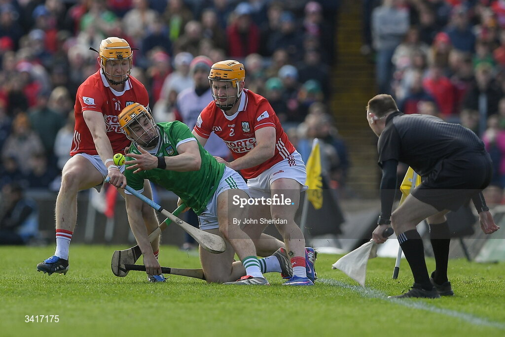 5 April 2026; Adam English of Limerick is tackled by Limerick players, from left, Aidan O'Connor and Niall O'Leary during the Allianz Hurling League Division 1A final match between Limerick and Cork at TUS Gaelic Grounds in Limerick. Photo by John Sheridan/Sportsfile