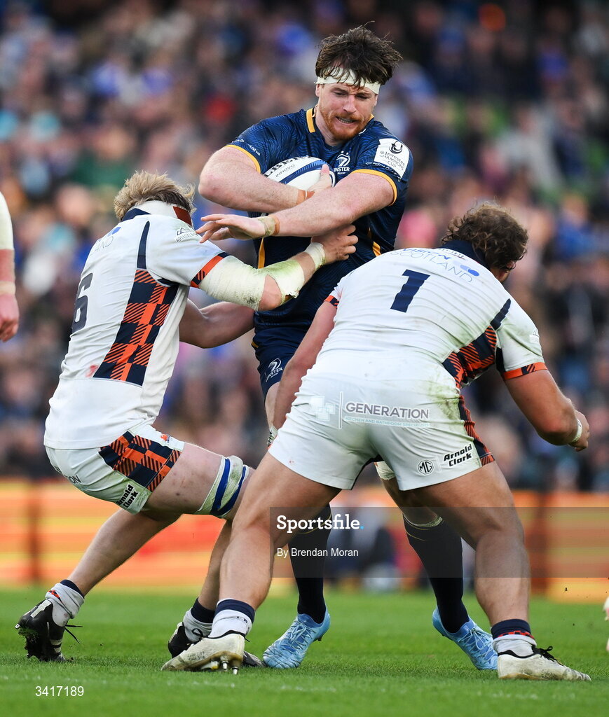 5 April 2026; Ryan Baird of Leinster is tackled by Liam McConnell and Pierre Schoeman of Edinburgh during the Investec Champions Cup match between Leinster and Edinburgh at the Aviva Stadium in Dublin. Photo by Brendan Moran/Sportsfile