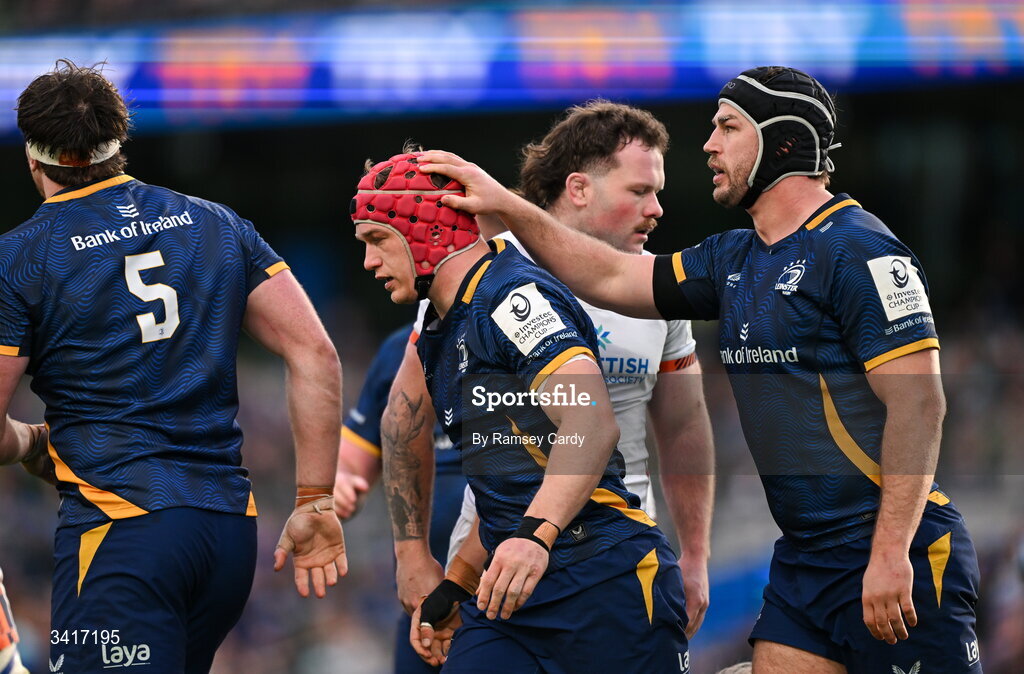 5 April 2026; Josh van der Flier, centre, is congratulated by Leinster teammate Caelan Doris after scoring their side's fifth try during the Investec Champions Cup match between Leinster and Edinburgh at the Aviva Stadium in Dublin. Photo by Ramsey Cardy/Sportsfile