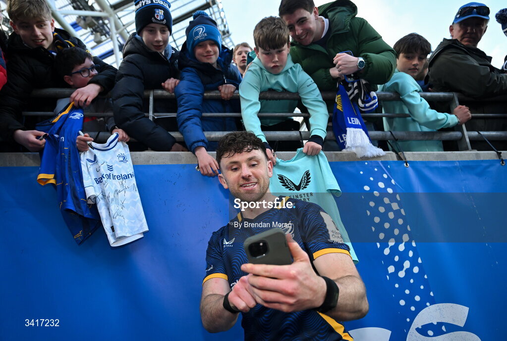 5 April 2026; Hugo Keenan of Leinster takes a selfie with supporters after the Investec Champions Cup match between Leinster and Edinburgh at the Aviva Stadium in Dublin. Photo by Brendan Moran/Sportsfile