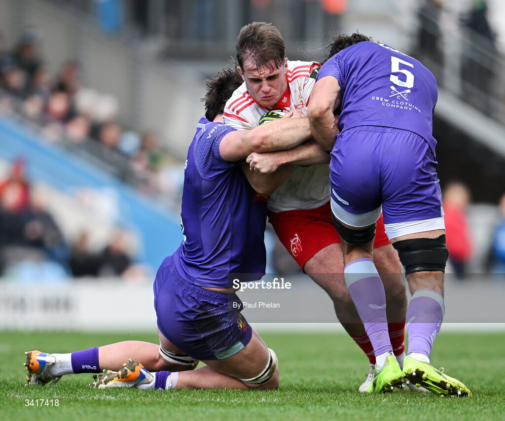 4 April 2026; Alex Kendellen of Munster Rugby is tackled by Dafydd Jenkins and Andrea Zambonin of Exeter Chiefs during the EPCR Challenge Cup match between Exeter Chiefs and Munster at Sandy Park in Exeter, England. Photo by Paul Phelan/Sportsfile