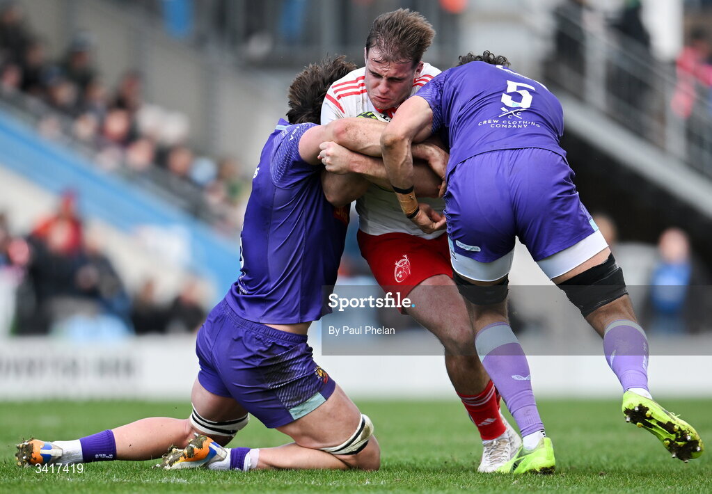 4 April 2026; Alex Kendellen of Munster Rugby is tackled by Dafydd Jenkins and Andrea Zambonin of Exeter Chiefs during the EPCR Challenge Cup match between Exeter Chiefs and Munster at Sandy Park in Exeter, England. Photo by Paul Phelan/Sportsfile