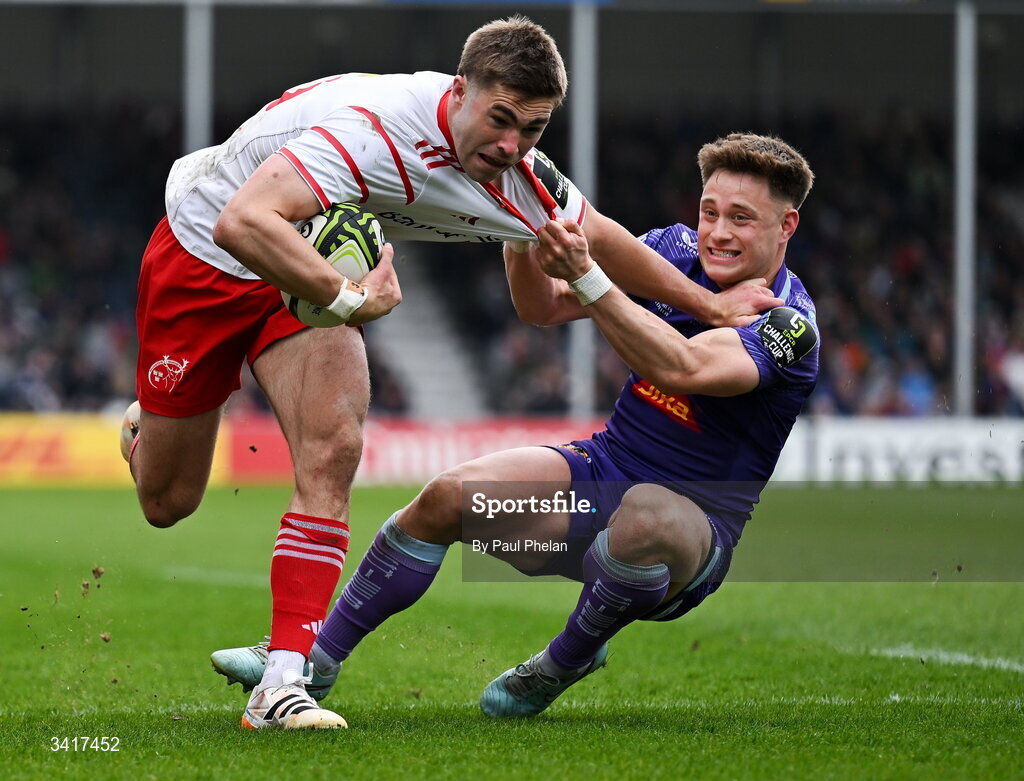 4 April 2026; Jack Crowley of Munster Rugby ,despite the tackle of Steve Varney of Exeter Chiefs, on his way to scoring his sides first try during the EPCR Challenge Cup match between Exeter Chiefs and Munster at Sandy Park in Exeter, England. Photo by Paul Phelan/Sportsfile