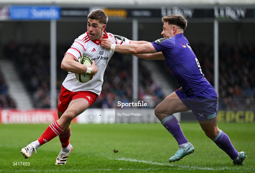 4 April 2026; Jack Crowley of Munster Rugby ,despite the tackle of Steve Varney of Exeter Chiefs, on his way to scoring his sides first try during the EPCR Challenge Cup match between Exeter Chiefs and Munster at Sandy Park in Exeter, England. Photo by Paul Phelan/Sportsfile