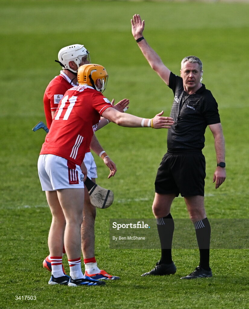 5 April 2026; Shane Barrett, 11, and Tommy O'Connell of Cork remonstrate with referee Shane Hynes during the Allianz Hurling League Division 1A final match between Limerick and Cork at TUS Gaelic Grounds in Limerick. Photo by Ben McShane/Sportsfile