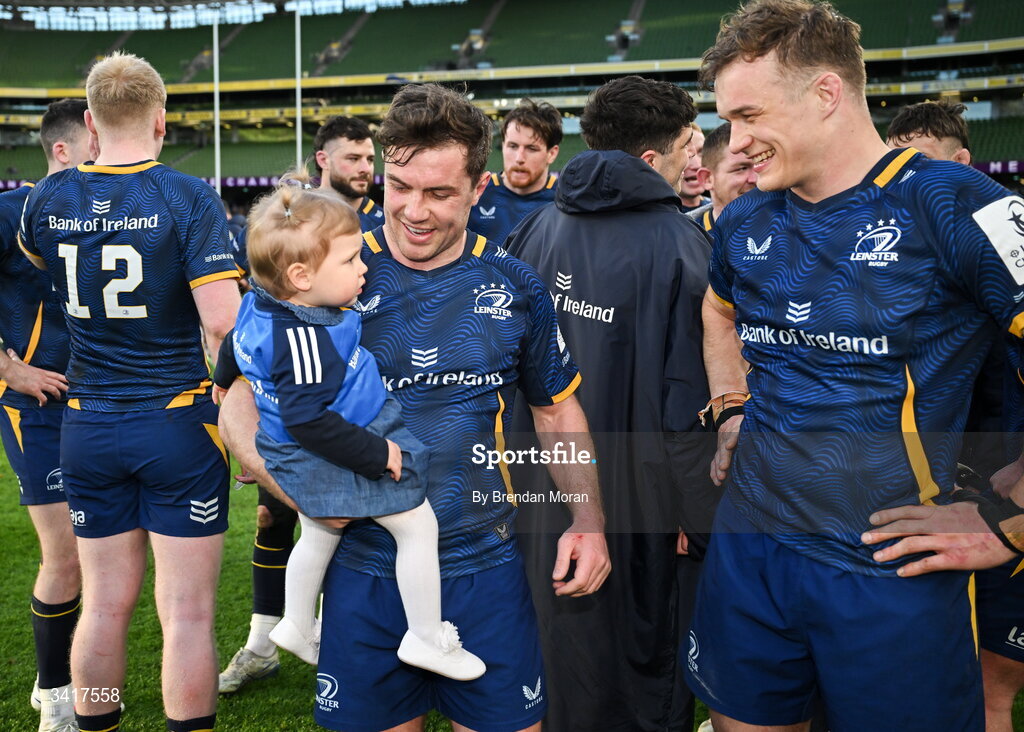 5 April 2026; Luke McGrath of Leinster and his daughter Sophia with teammate Josh van der Flier after the Investec Champions Cup match between Leinster and Edinburgh at the Aviva Stadium in Dublin. Photo by Brendan Moran/Sportsfile